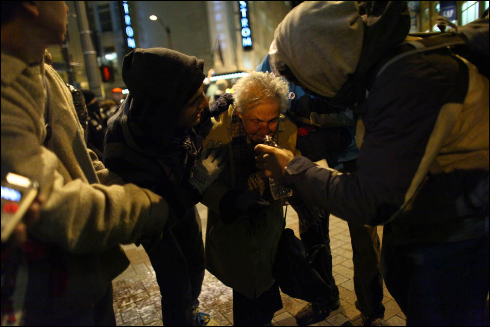 Seattle activist Dorli Rainey, 84, reacts after being hit with pepper spray during an Occupy Seattle protest on Tuesday, November 15, 2011 at Westlake Park. Protesters gathered in the intersection of 5th Avenue and Pine Street after marching from their camp at Seattle Central Community College in support of Occupy Wall Street. Many refused to move from the intersection after being ordered by police. Police then began spraying pepper spray into the gathered crowd hitting dozens of people. Rainey had a milky solution splashed in her face to help with the effect of the pepper spray. (Photo by Joshua Trujillo, seattlepi.com)